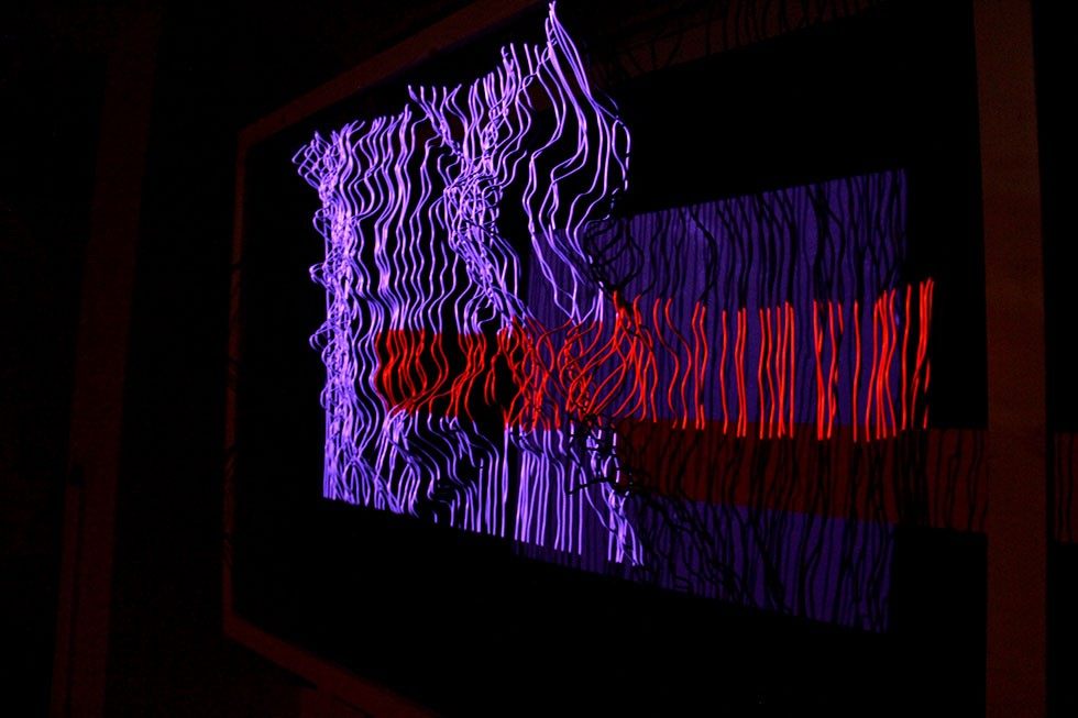 The relief mapped in violet and red, the wires reading as a ridged landscape.